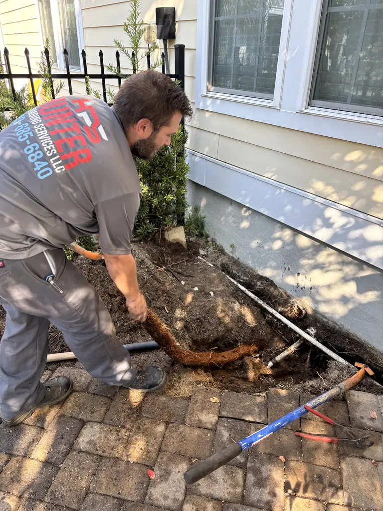 Hunter Plumbing Services technician removing tree roots from a sewer line in Myrtle Beach, SC