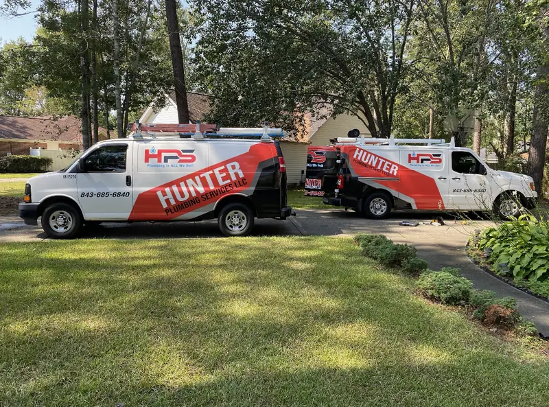 Two Hunter Plumbing Services branded service vans in Myrtle Beach, SC